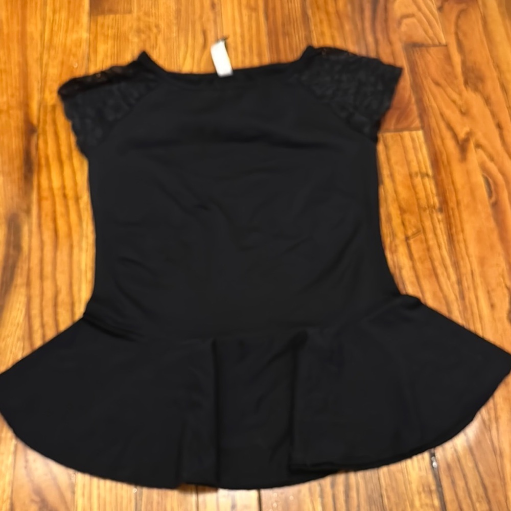 Chic Black Peplum style top with Lace Accents